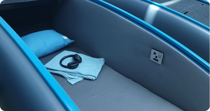 Premium airline seat with personal amenities in a modern cabin