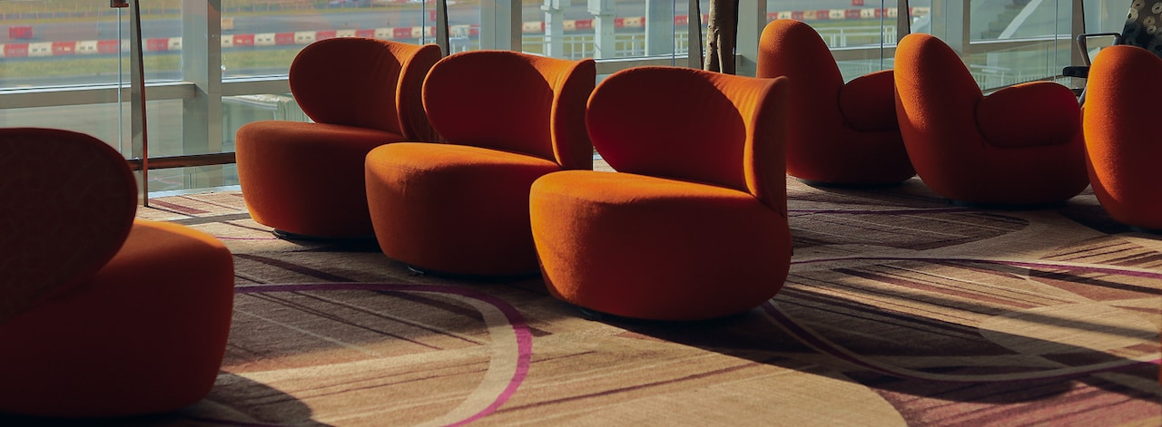 Airport lounge with modern orange armchairs