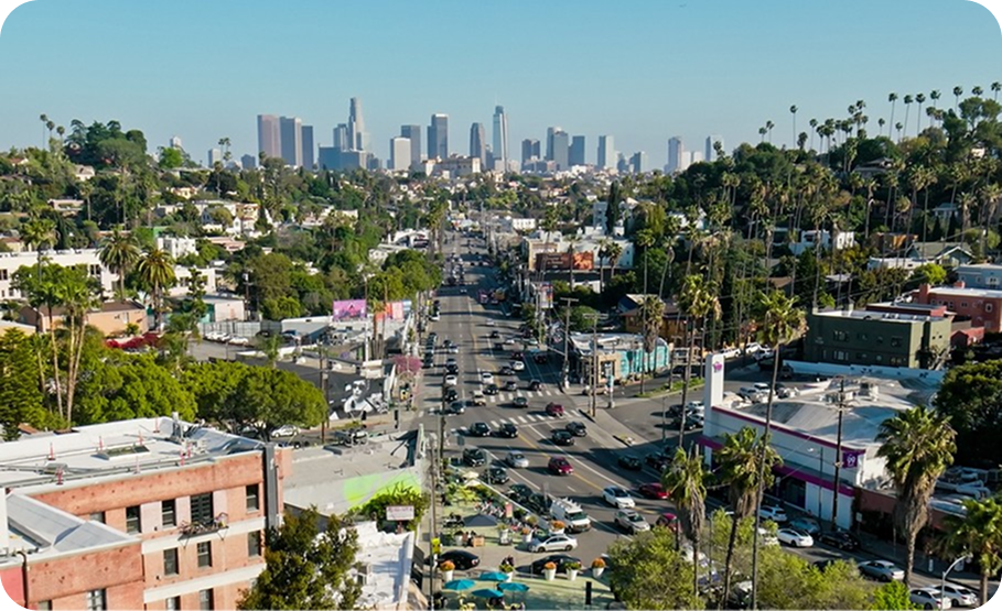 Distant view of downtown Los Angeles skyline from Silver Lake on a sunny day.