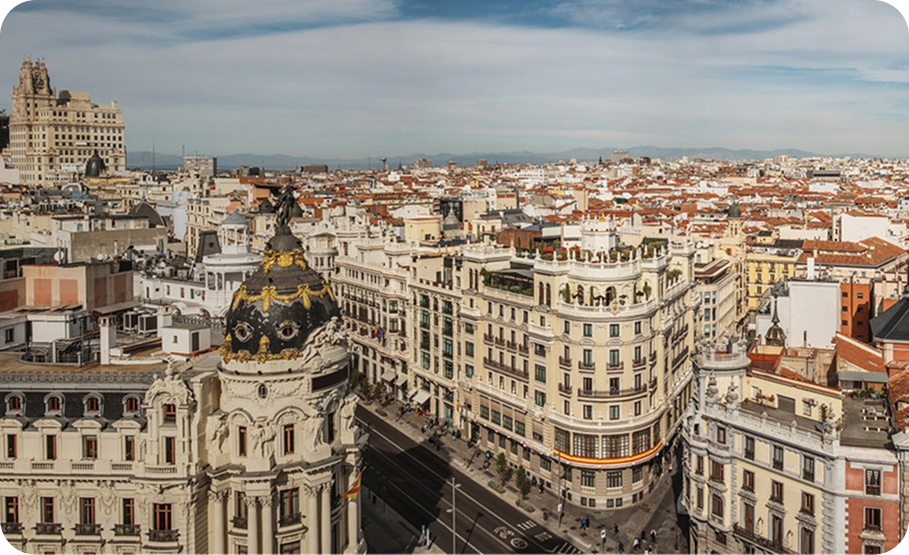 Grand avenues and classical architecture in the city center of Madrid, Spain.