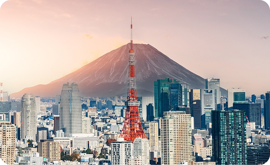 Tokyo city skyline dominated by the vibrant red and white Tokyo Tower amidst urban high-rises.