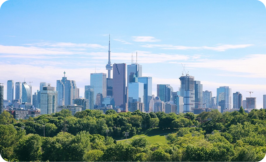 Aerial view of the Toronto city skyline featuring the CN Tower and surrounding skyscrapers.