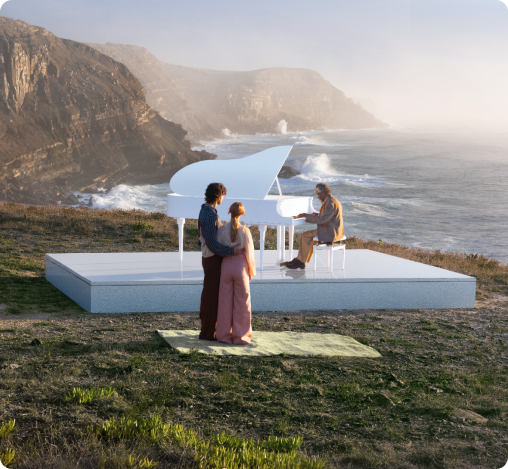 Outdoor luxury dining experience overlooking a scenic lake and mountains at sunset